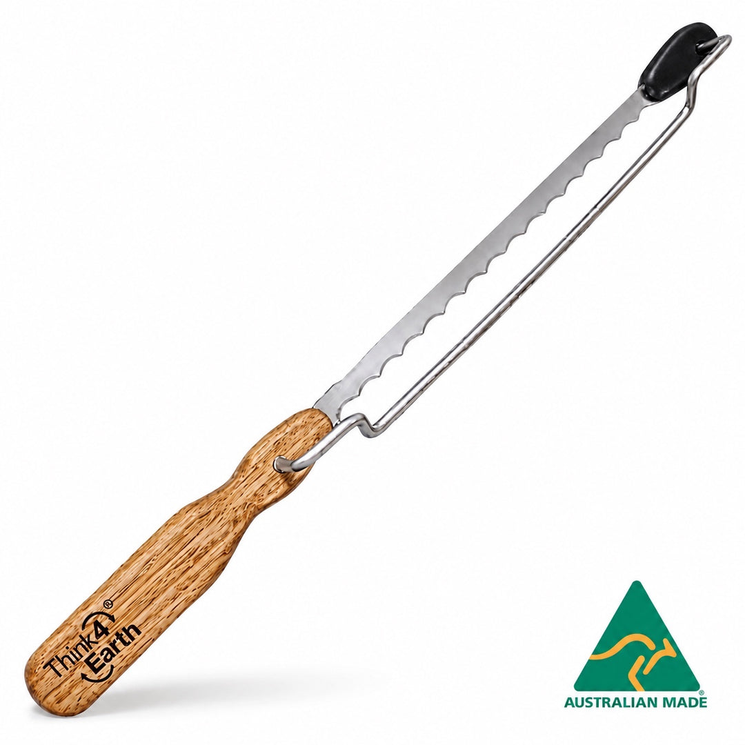 Think4Earth adjustable bread saw with Tasmanian Oak handle and stainless steel blade. Features brass bush and adjustable guard.
