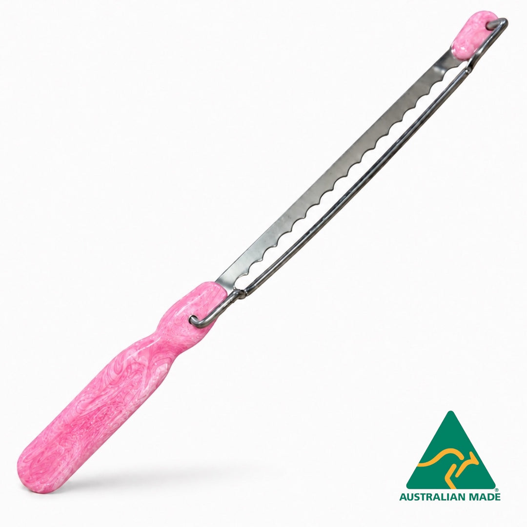 Think4Earth pink and white marbled recycled plastic bread saw with adjustable stainless steel blade.