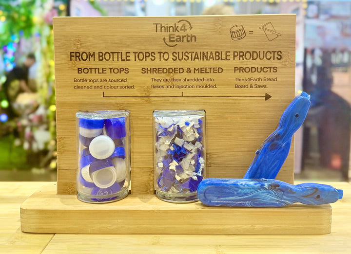 Think4Earth blue marbled recycled HDPE bread saw with adjustable slice guide and stainless steel guard.