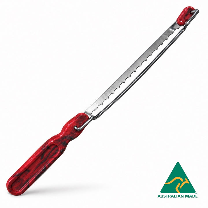 Think4Earth red and black marbled recycled plastic bread saw with adjustable slice guide and stainless steel blade.