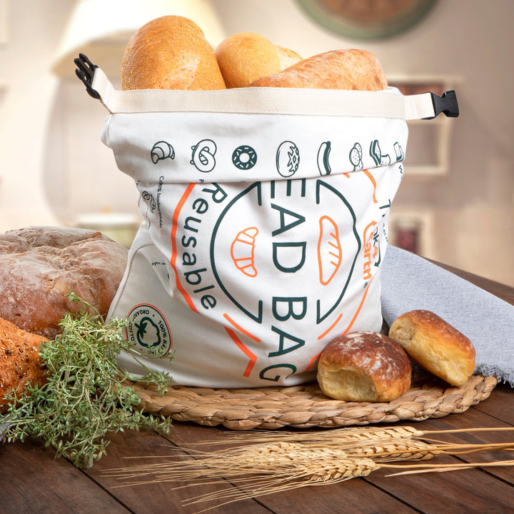 Think4Earth reusable organic cotton bread bag filled with various breads, featuring a roll-and-clip closure and bread-themed graphics.