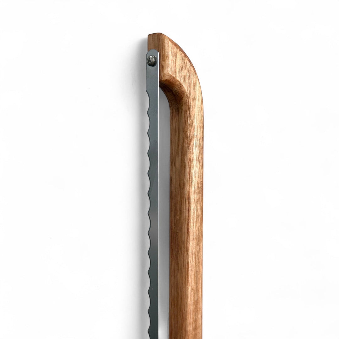 Think4Earth Tasmanian Oak bread saw with stainless steel serrated blade, fixed for toast thickness.