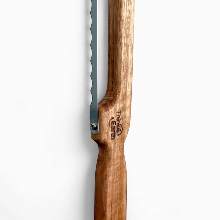 Think4Earth Tasmanian Oak bread saw with stainless steel serrated blade, fixed for toast thickness.